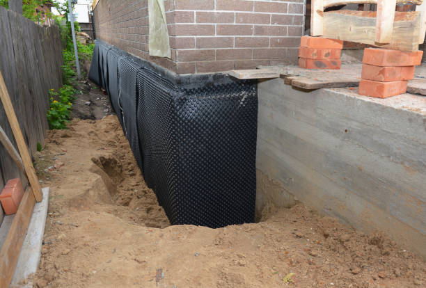 Happy homeowners after waterproofing job in Allen